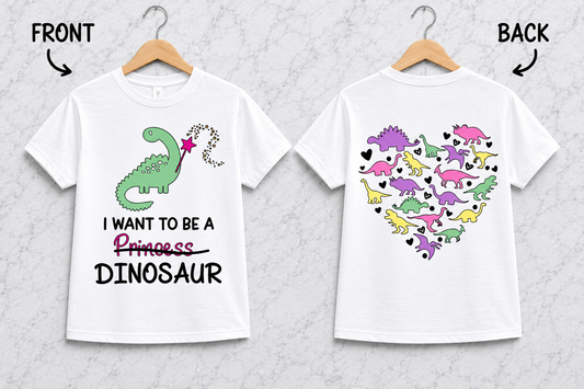 White and black dinosaur front and back graphic shirt featuring I Want To Be A Dinosaur design and colorful dinosaur heart artwork on the back.